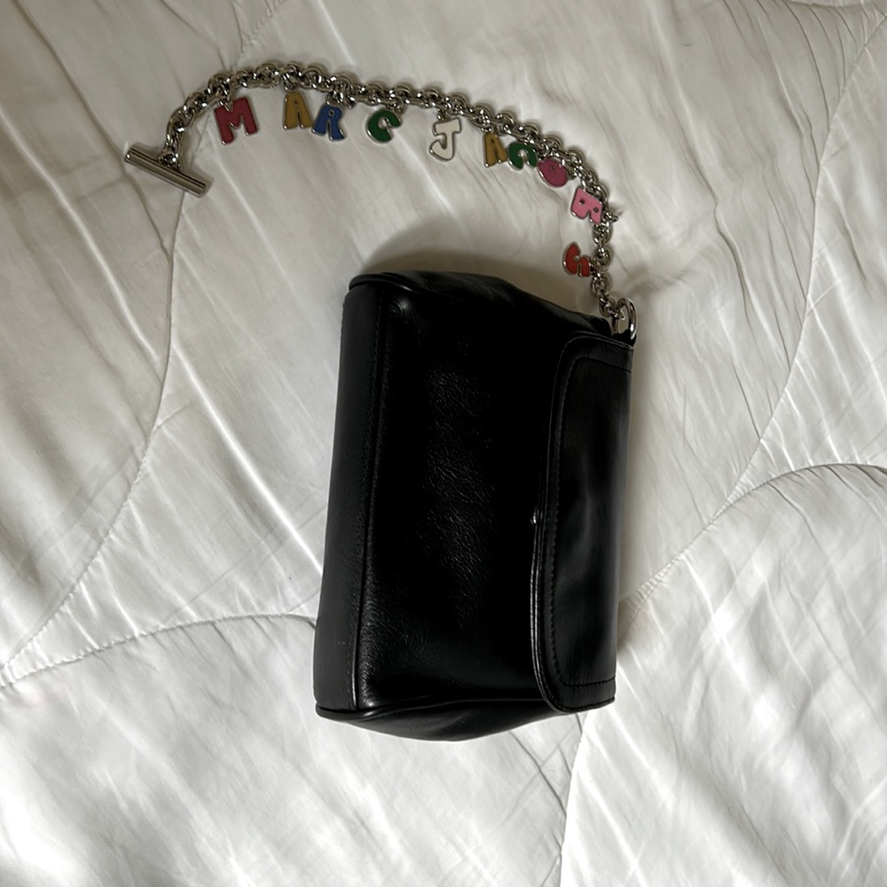 Marc Jacob’s black calf skin leather wristlet with Marc Jacob’s colored letters